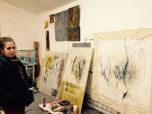 Katelynn Mills in her studio with some recent works.